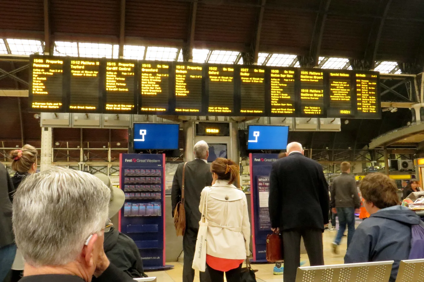 Passengers under the departure boards at Paddington station